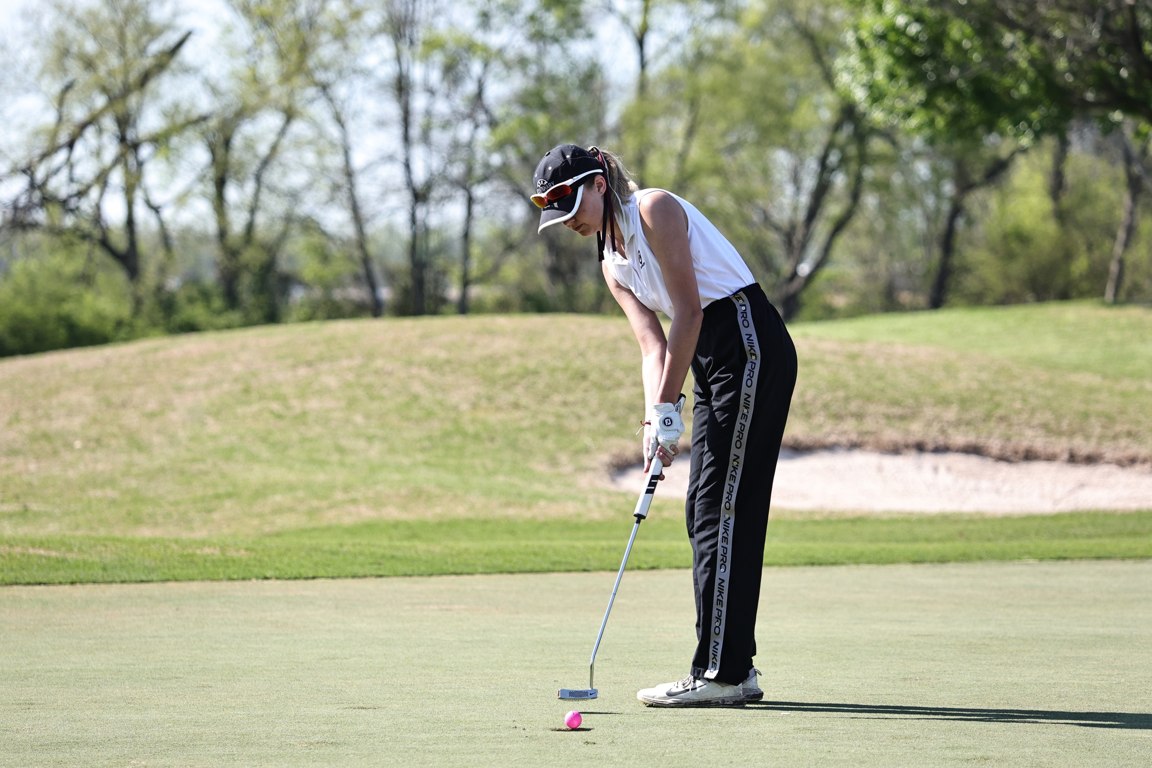 Sophomore Jordyn Templeton (Columbus, Texas) and the Ladies tee off at Cypress Bend Resort on Monday.